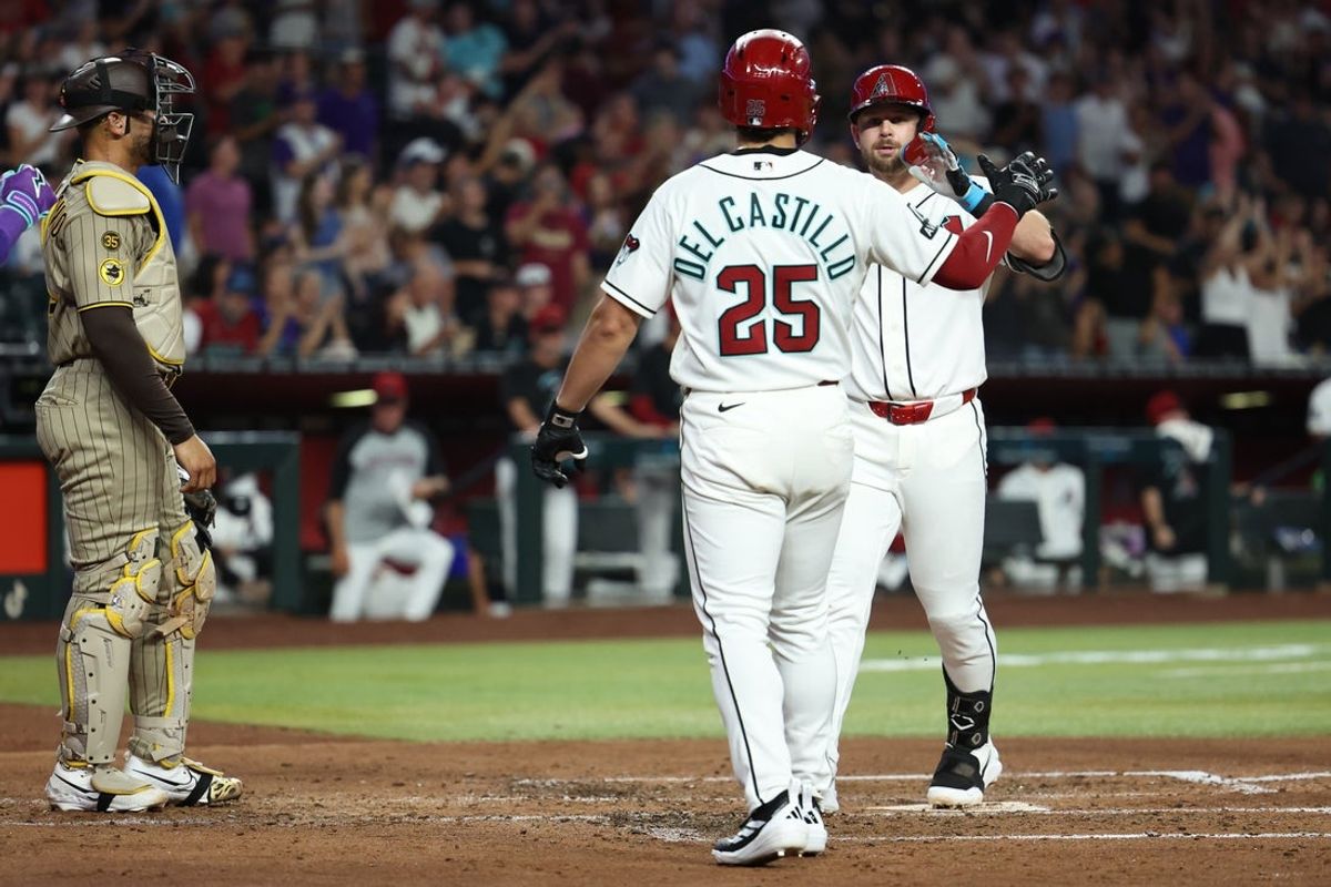 Aug 3, 2026; Phoenix, Arizona, USA; Arizona Diamondbacks outfielder Tim Tawa (13) high fives Arizona Diamondbacks designated hitter Adrian Del Castillo (25) after hitting a three-run home run against San Diego Padres pitcher Michael King (34) in the fourth inning at Chase Field. Mandatory Credit: Anna Carrington-Imagn Images