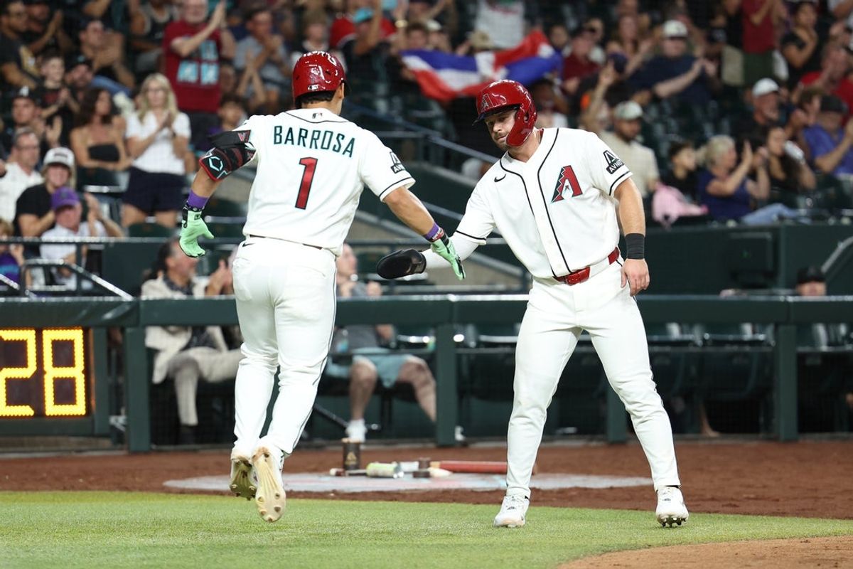 Aug 3, 2026; Phoenix, Arizona, USA; Arizona Diamondbacks outfielder Jorge Barrosa (1) high fives Arizona Diamondbacks outfielder Tim Tawa (13) after hitting an sacrifice RBI single in the eighth inning at Chase Field. Mandatory Credit: Anna Carrington-Imagn Images