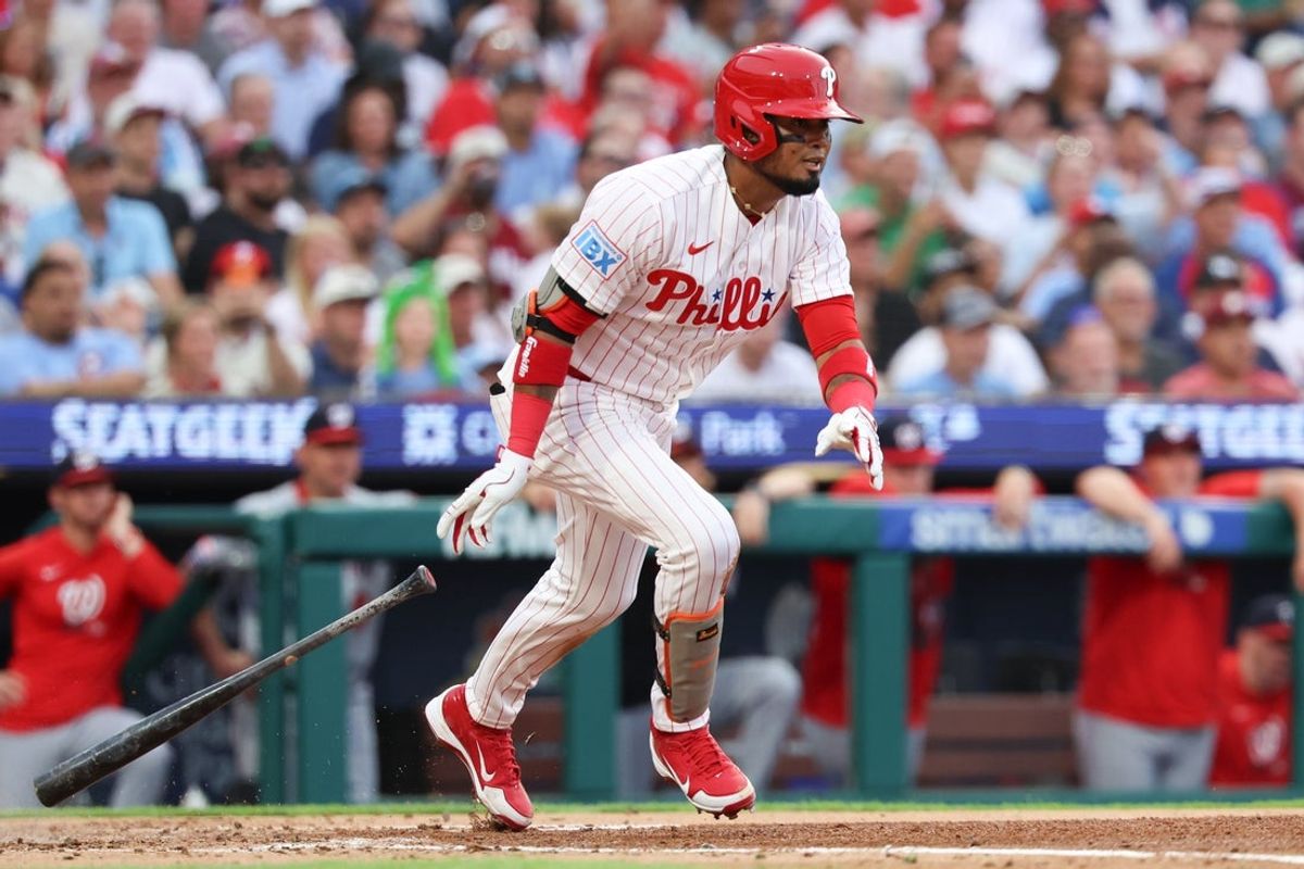 Aug 4, 2026; Philadelphia, Pennsylvania, USA; Philadelphia Phillies second baseman Luis Arraez (4) hits an RBI double against the Washington Nationals during the third inning at Citizens Bank Park. Mandatory Credit: Bill Streicher-Imagn Images