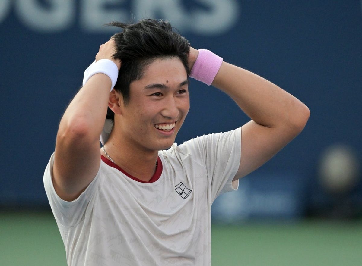 Aug 4, 2026; Montreal, QC, Canada; Juncheng Shang (CHN) reacts after winning against Andrey Rublev during second round play at IGA Stadium. Mandatory Credit: Eric Bolte-Imagn Images