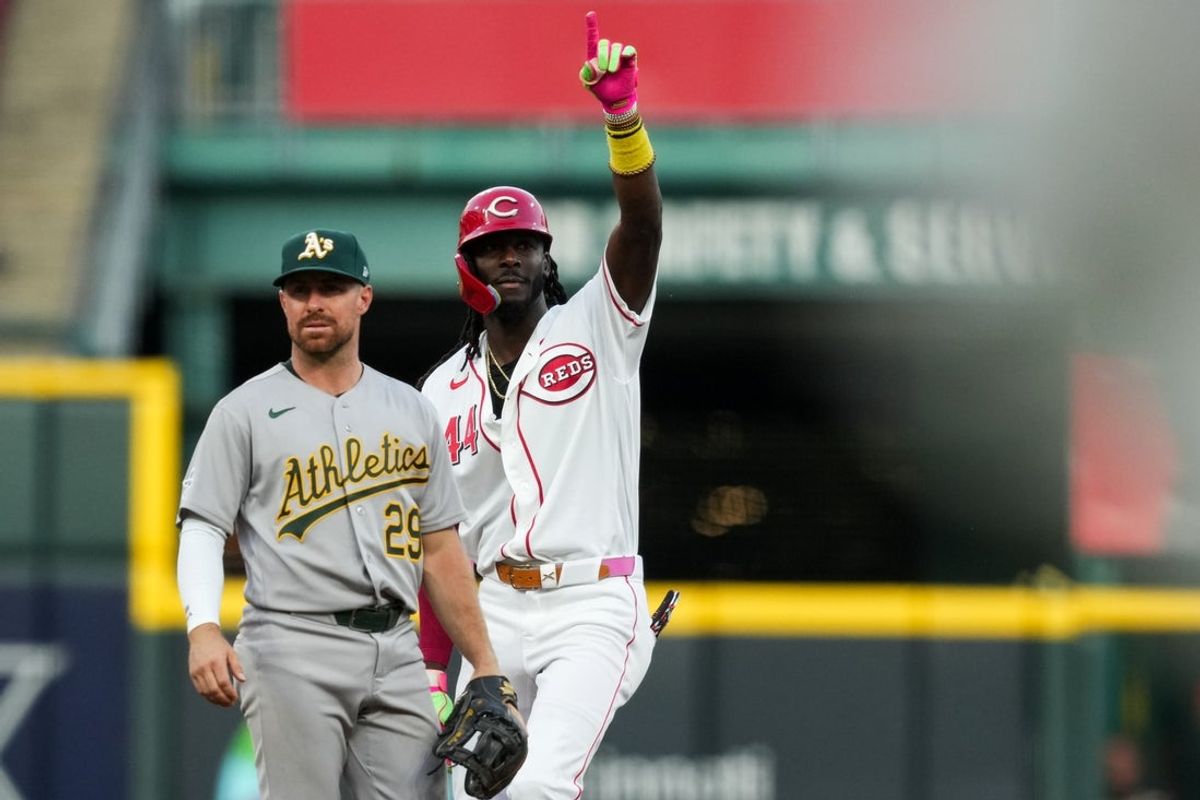 Aug 4, 2026; Cincinnati, Ohio, USA;  Cincinnati Reds shortstop Elly de la Cruz gestures as he stands at second base, after hitting a two-run single against the Athletics in the fifth inning at Great American Ball Park. Mandatory Credit: Aaron Doster-Imagn Images