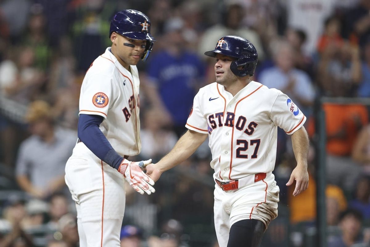 Aug 4, 2026; Houston, Texas, USA; Houston Astros second baseman Jose Altuve (27) celebrates with right fielder Cam Smith (11) after scoring a run during the fourth inning against the Toronto Blue Jays at Daikin Park. Mandatory Credit: Troy Taormina-Imagn Images