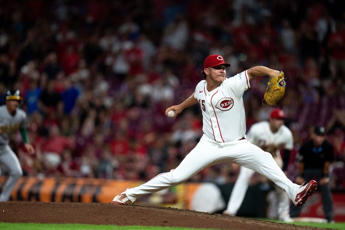Cincinnati Reds pitcher Emilio Pagan (15) delivers a pitch in the ninth inning between the Athletics and Cincinnati Reds at Great American Ball Park in Cincinnati on Tuesday, August 4, 2026.