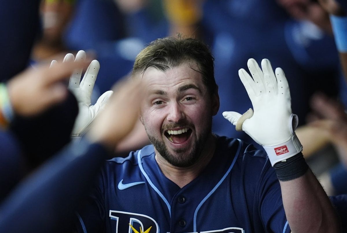 Aug 4, 2026; Denver, Colorado, USA; Tampa Bay Rays catcher Liam Hicks (34) celebrates his grand slam home run in the third inning against the Colorado Rockies at Coors Field. Mandatory Credit: Ron Chenoy-Imagn Images