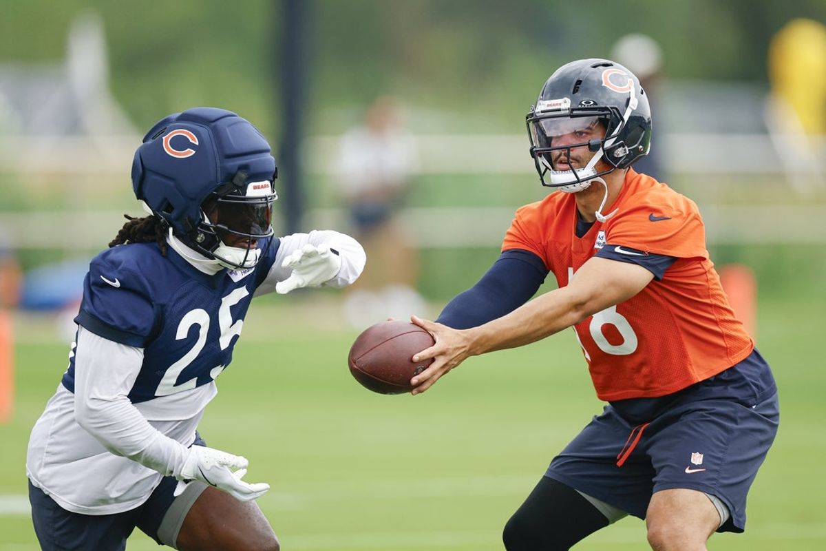 Aug 5, 2026; Lake Forest, IL, USA; Chicago Bears quarterback Caleb Williams (18) passes the ball to running back Kyle Monangai (25) during training camp at Halas Hall. Mandatory Credit: Kamil Krzaczynski-Imagn Images