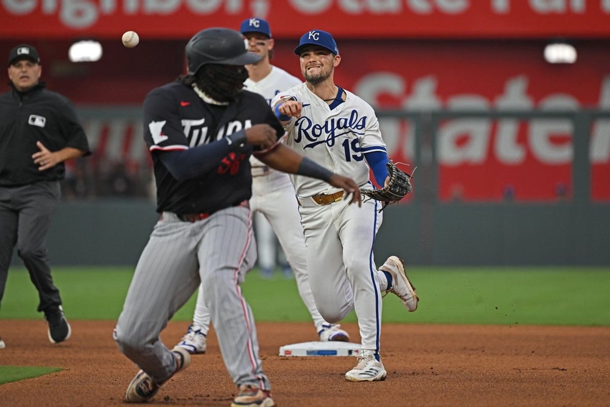 Aug 5, 2026; Kansas City, Missouri, USA;  Kansas City Royals second baseman Michael Massey (19) throws to first base around Minnesota Twins designated hitter Josh Bell (56) in the fourth inning at Kauffman Stadium. Mandatory Credit: Peter Aiken-Imagn Images