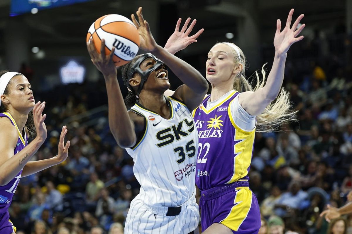 Aug 5, 2026; Chicago, Illinois, USA; Chicago Sky guard Aicha Coulibaly (35) drives to the basket against Los Angeles Sparks forward Cameron Brink (22) during the first half of a WNBA game at Wintrust Arena. Mandatory Credit: Kamil Krzaczynski-Imagn Images