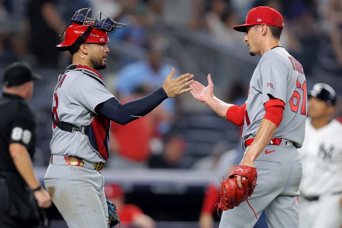 Aug 5, 2026; Bronx, New York, USA; St. Louis Cardinals catcher Ivan Herrera (48) and relief pitcher Riley O'Brien (61) celebrate after defeating the New York Yankees at Yankee Stadium. Mandatory Credit: Brad Penner-Imagn Images