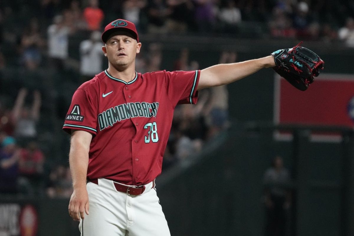 Aug 5, 2026; Phoenix, Arizona, USA; Arizona Diamondbacks pitcher Paul Sewald (38) reacts after defeating the San Diego Padres at Chase Field. Mandatory Credit: Rick Scuteri-Imagn Images