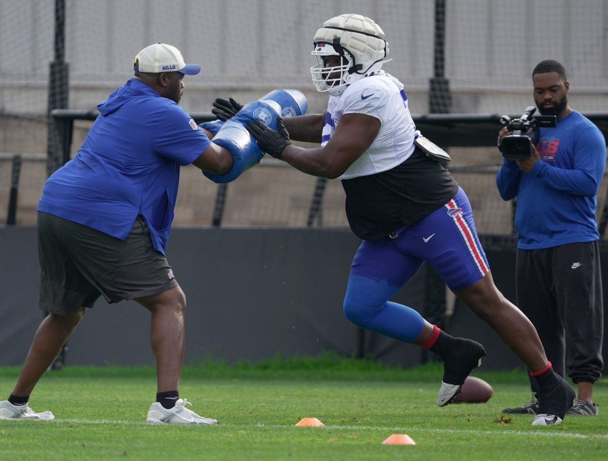 Bills Phidarian Mathis hits the pad during a drill at Buffalo Bills Training Camp at St. John Fisher University in Pittsford on Aug. 6, 2026.