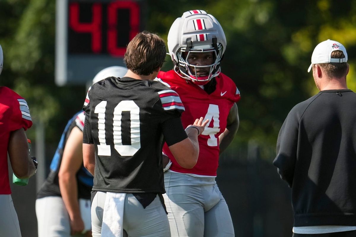 Ohio State Buckeyes quarterback Julian Sayin (10) talks to wide receiver Jeremiah Smith (4) during the first practice of training camp at the Woody Hayes Athletic Center in Columbus on Aug. 6, 2026.