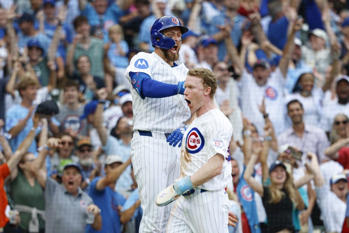 Aug 6, 2026; Chicago, Illinois, USA; Chicago Cubs designated hitter Pete Crow-Armstrong (4) celebrates with first baseman Michael Busch (29) after scoring a game winning run against the Toronto Blue Jays during the 11th inning at Wrigley Field. Mandatory Credit: Kamil Krzaczynski-Imagn Images