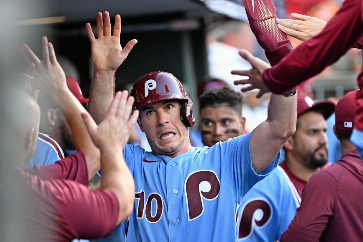 Aug 6, 2026; Philadelphia, Pennsylvania, USA; Philadelphia Phillies catcher J.T. Realmuto (10) celebrates after scoring a run during the third inning against the Washington Nationals at Citizens Bank Park. Mandatory Credit: Eric Hartline-Imagn Images