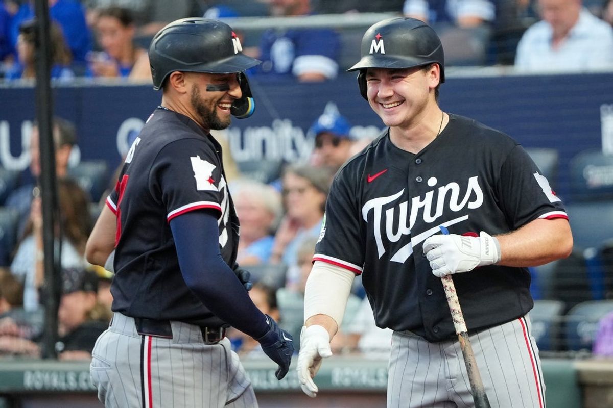 Aug 6, 2026; Kansas City, Missouri, USA; Minnesota Twins first baseman Royce Lewis (23) celebrates with right fielder Alan Roden (18) after hitting a solo home run against the Kansas City Royals during the fifth inning at Kauffman Stadium. Mandatory Credit: Denny Medley-Imagn Images