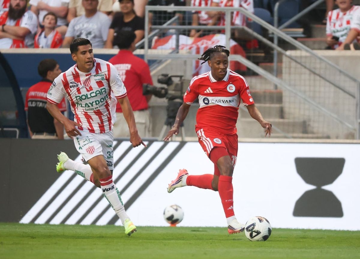 Aug 6, 2026; Bridgeview, IL, USA; Chicago Fire FC forward Puso Dithejane (12) and Necaxa defender Raul Martinez (33) battle for control of the ball during the first half during the Leagues Cup Phase One match at SeatGeek Stadium. Mandatory Credit: Talia Sprague-Imagn Images
