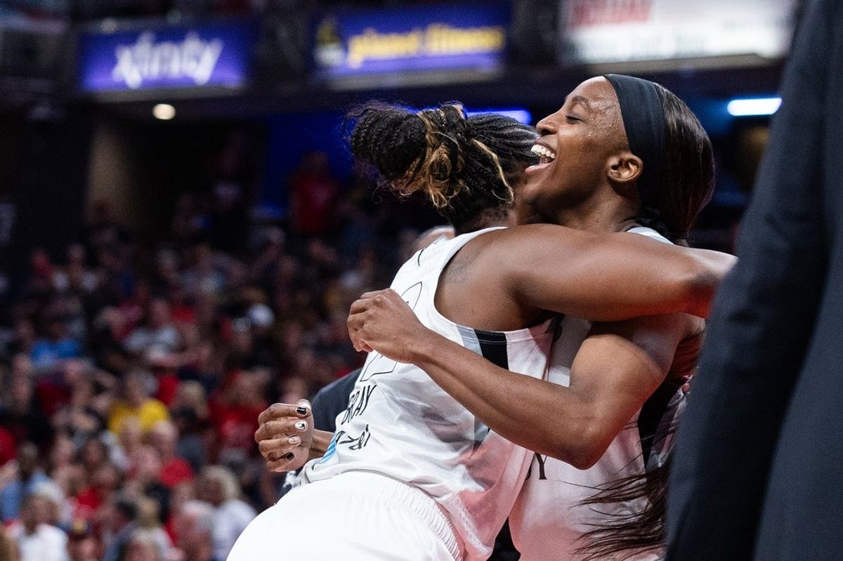 Aug 6, 2026; Indianapolis, Indiana, USA;  Las Vegas Aces guard Chelsea Gray (12) celebrates with guard Jackie Young (0) after scoring the game-winning basket against the Indiana Fever at Gainbridge Fieldhouse. Mandatory Credit: Trevor Ruszkowski-Imagn Images