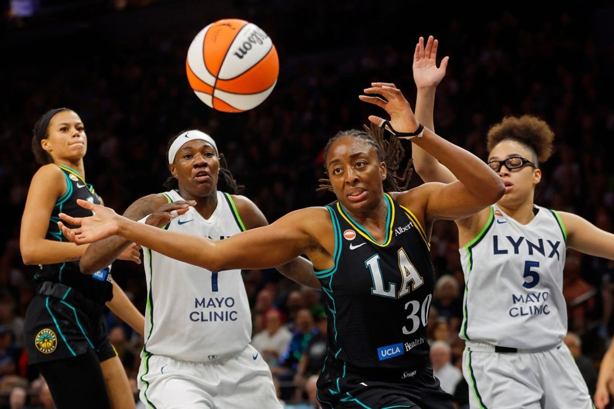 Aug 6, 2026; Minneapolis, Minnesota, USA; Los Angeles Sparks forward Nneka Ogwumike (30) vies for a loose ball against Minnesota Lynx forward Natasha Howard (1) and guard Olivia Miles (5) during the first quarter at Target Center. Mandatory Credit: Bruce Kluckhohn-Imagn Images