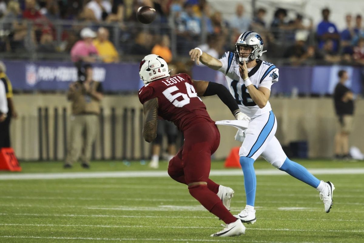 Aug 6, 2026; Canton, Ohio, USA; Carolina Panthers quarterback Kenny Pickett (12) passes against Arizona Cardinals linebacker Eku Leota (54) at Tom Benson Hall of Fame Stadium. Mandatory Credit: Charles LeClaire-Imagn Images