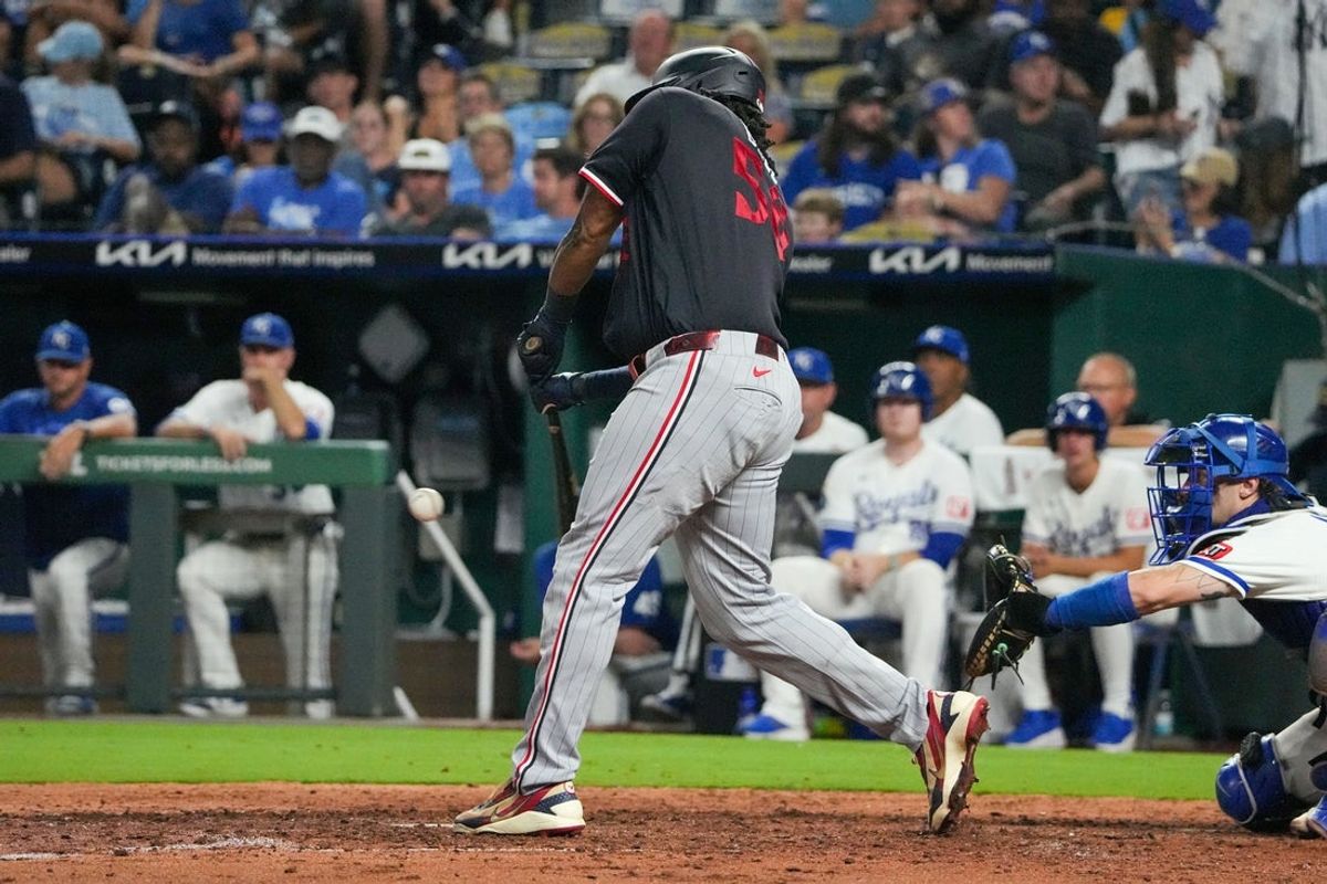 Aug 6, 2026; Kansas City, Missouri, USA; Minnesota Twins designated hitter Josh Bell (56) hits a one run single against the Kansas City Royals during the eighth inning at Kauffman Stadium. Mandatory Credit: Denny Medley-Imagn Images