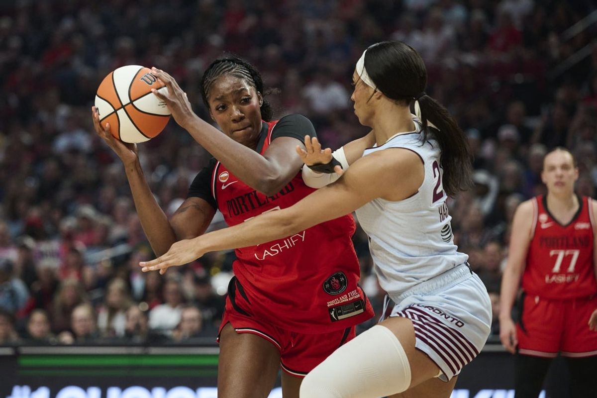 Aug 6, 2026; Portland, Oregon, USA; Portland Fire forward Serah Williams (25) drives to the basket during the first half against Toronto Tempo forward Isabelle Harrison (21) at Moda Center. Mandatory Credit: Troy Wayrynen-Imagn Images