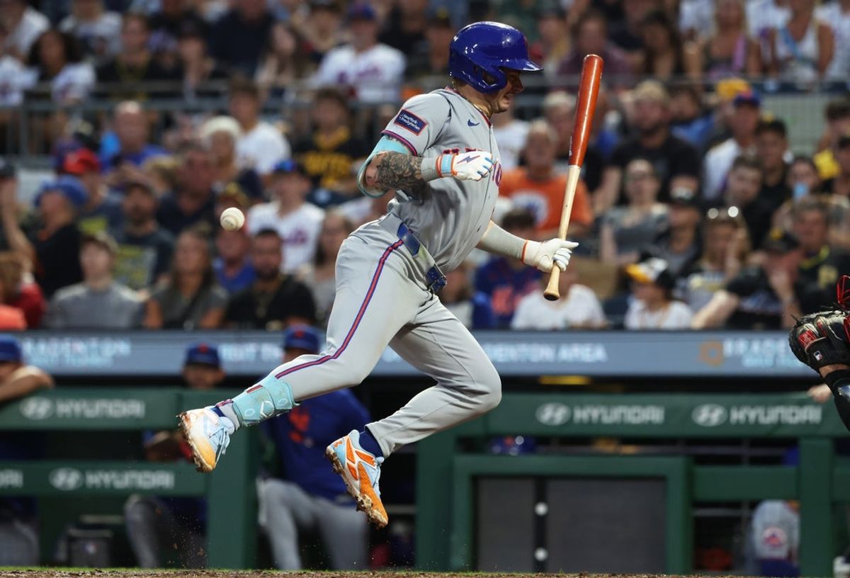 Aug 7, 2026; Pittsburgh, Pennsylvania, USA;  New York Mets center fielder A.J. Ewing (9) reacts after being hit by a pitch from Pittsburgh Pirates relief pitcher Evan Sisk (not pictured) during the fourth inning at PNC Park. Mandatory Credit: Charles LeClaire-Imagn Images