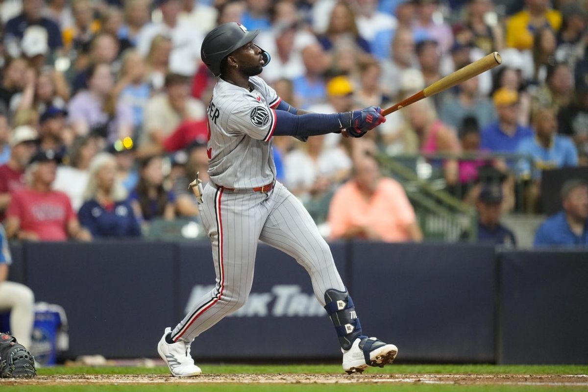 Aug 7, 2026; Milwaukee, Wisconsin, USA;  Minnesota Twins shortstop Kaelen Culpepper (12) hits his first career hit and home run during the fourth inning against the Milwaukee Brewers at American Family Field. Mandatory Credit: Jeff Hanisch-Imagn Images