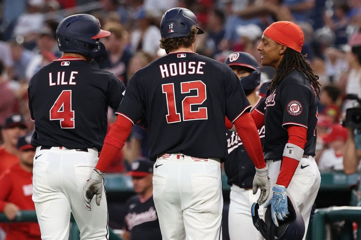 Aug 7, 2026; Washington, District of Columbia, USA; Washington Nationals left fielder Daylen Lile (4) celebrates with Nationals third baseman Brady House (12) and Nationals shortstop CJ Abrams (5) after hitting a three run home run against the Cincinnati Reds during the first inning at Nationals Park. Mandatory Credit: Geoff Burke-Imagn Images