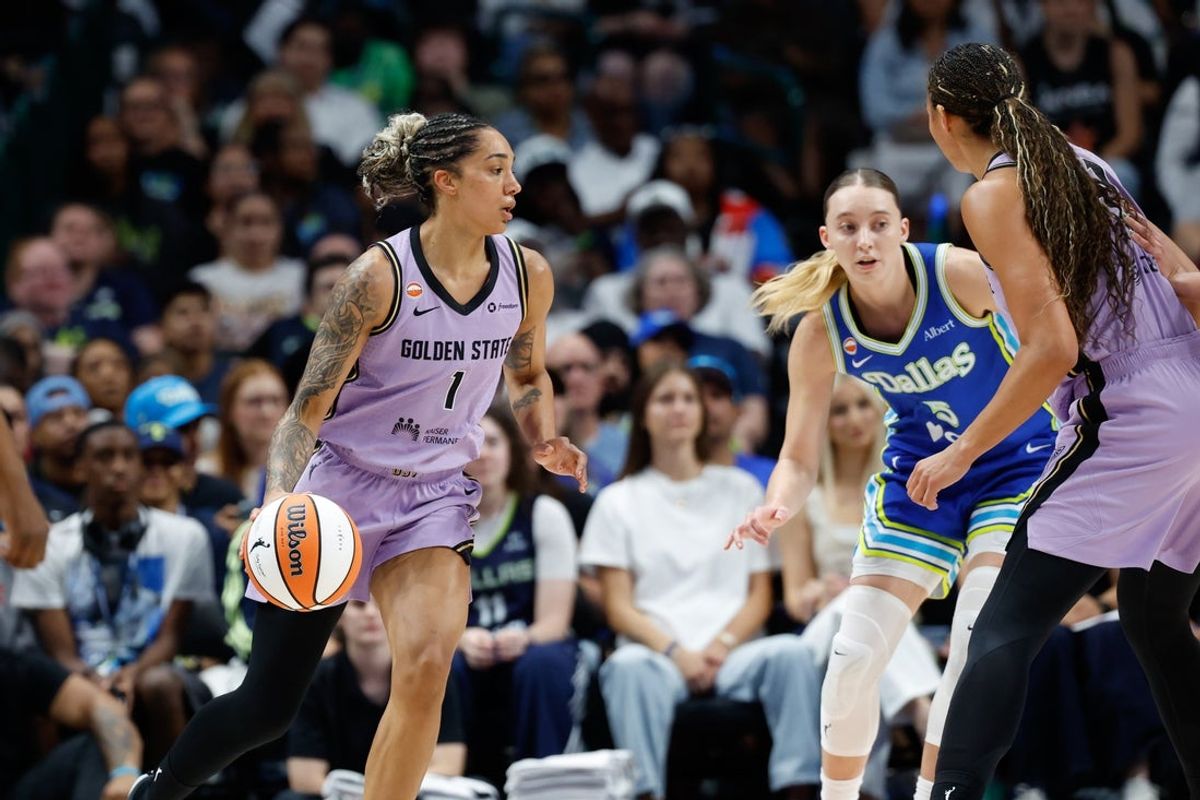 Aug 7, 2026; Dallas, Texas, USA; Golden State Valkyries forward Gabby Williams (1) controls the ball as Dallas Wings guard Paige Bueckers (5) defends during the first half at American Airlines Center. Mandatory Credit: Chris Jones-Imagn Images