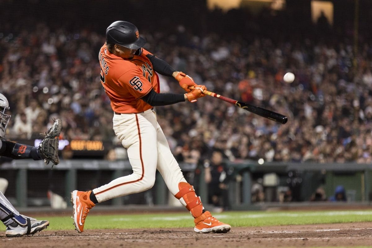 Aug 7, 2026; San Francisco, California, USA;  San Francisco Giants shortstop Willy Adames (2) hits a solo home run against the Detroit Tigers during the fifth inning at Oracle Park. Mandatory Credit: John Hefti-Imagn Images