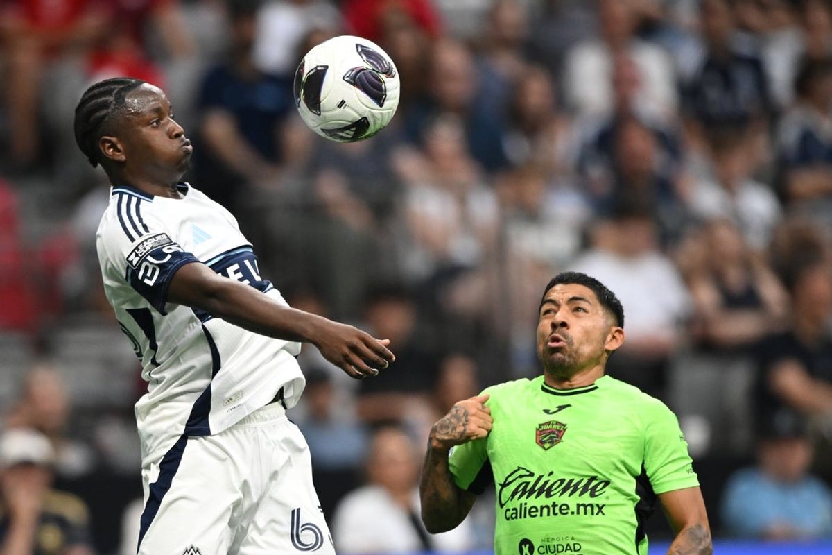 Aug 7, 2026; Vancouver, British Columbia, CAN; Vancouver Whitecaps FC defense Ralph Priso (6) heads the ball against FC Juarez forward Javier Aquino (20) during the first half during the Leagues Cup Phase One match at BC Place. Mandatory Credit: Anne-Marie Sorvin-Imagn Images
