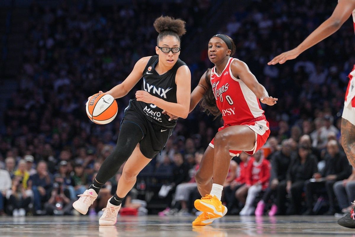 Aug 8, 2026; Minneapolis, Minnesota, USA; Minnesota Lynx forward Olivia Miles (5) dribbles against the Las Vegas Aces forward Jackie Young (0) in the third quarter at Target Center. Mandatory Credit: Brad Rempel-Imagn Images