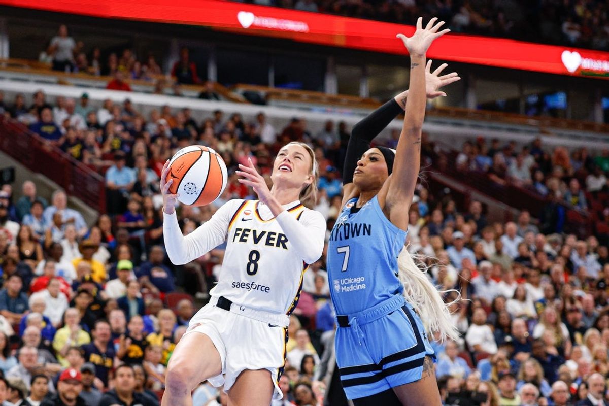 Aug 8, 2026; Chicago, Illinois, USA; Indiana Fever guard Sophie Cunningham (8) drives to the basket against Chicago Sky guard DiJonai Carrington (7) during the first half at United Center. Mandatory Credit: Kamil Krzaczynski-Imagn Images