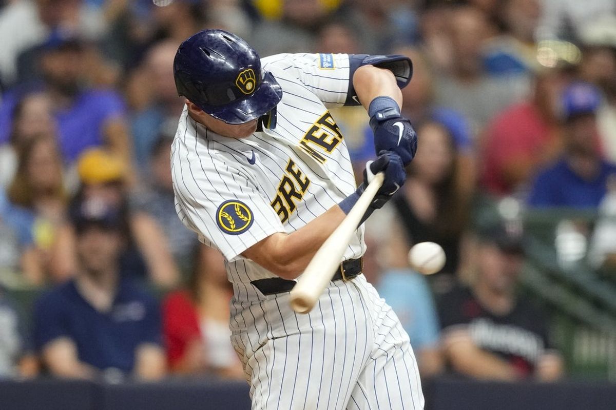 Aug 8, 2026; Milwaukee, Wisconsin, USA;  Milwaukee Brewers first baseman Andrew Vaughn (28) hits an RBI single during the eighth inning against the Minnesota Twins at American Family Field. Mandatory Credit: Jeff Hanisch-Imagn Images