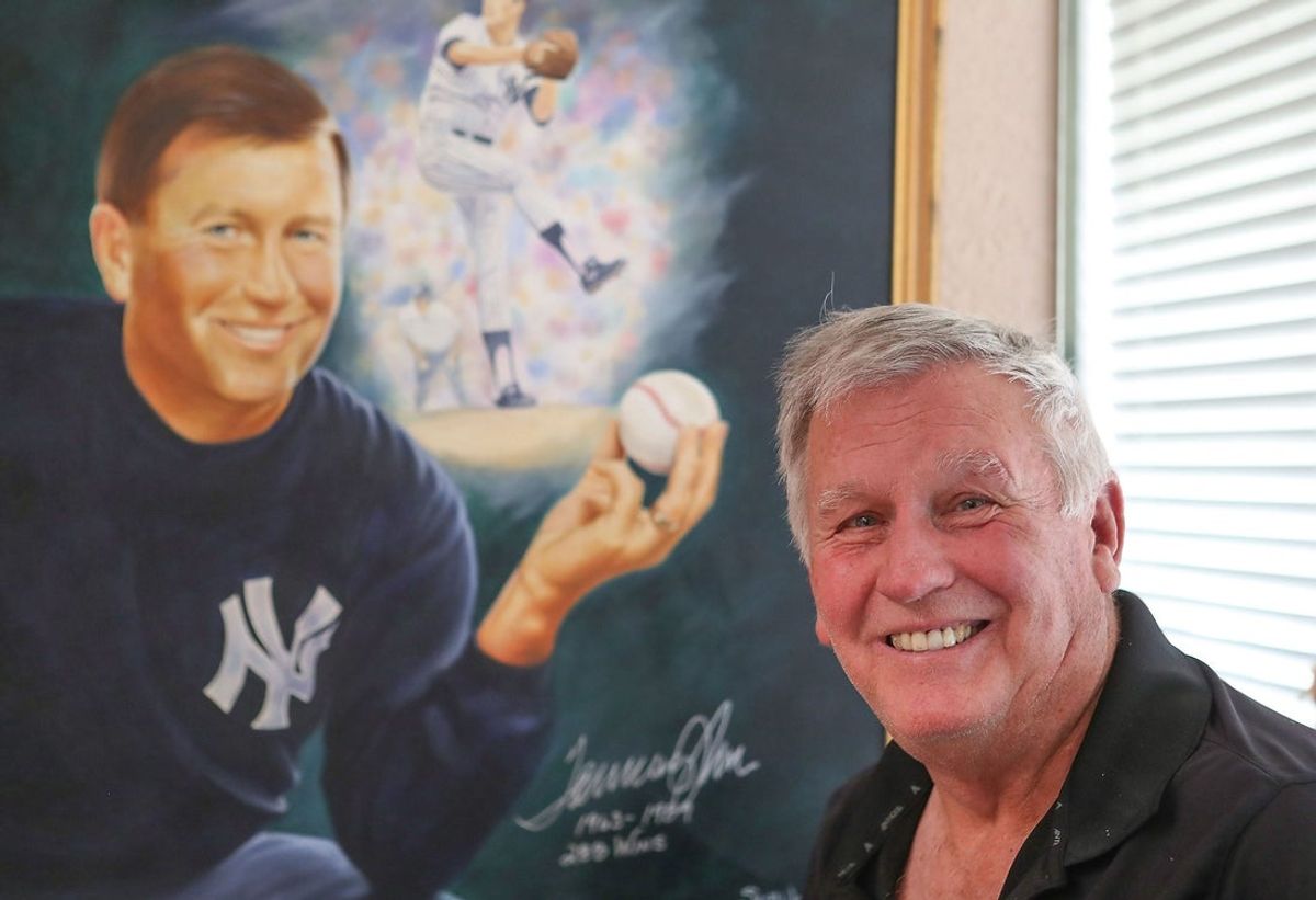 This file photo from June 6, 2019 shows former Major League Baseball pitcher Tommy John at his home in La Quinta, Calif.