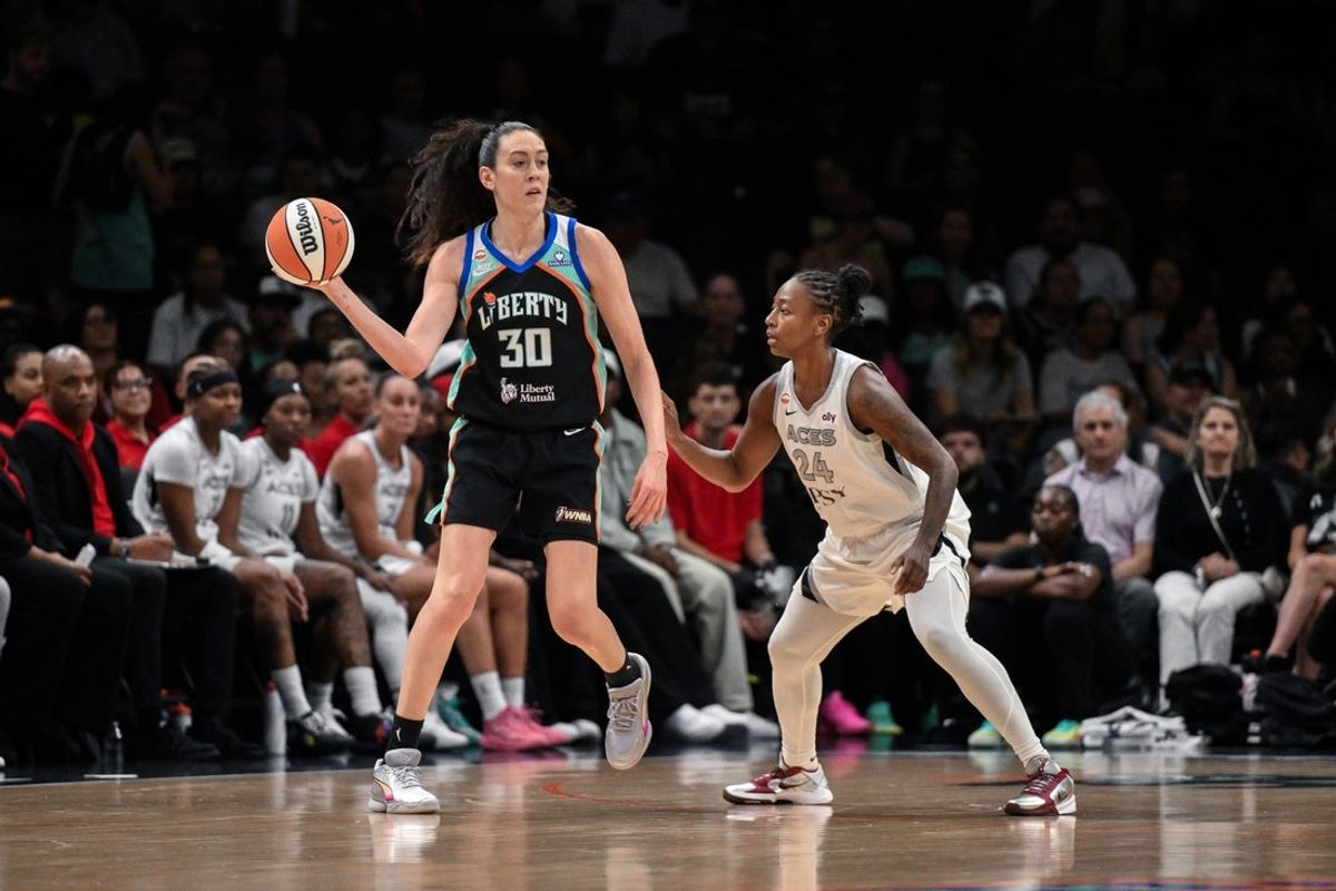 Aug 9, 2026; Brooklyn, New York, USA; New York Liberty forward Breanna Stewart (30) looks to pass the ball as Las Vegas Aces guard Jewell Loyd (24) defends during the first half at Barclays Center. Mandatory Credit: John Jones-Imagn Images