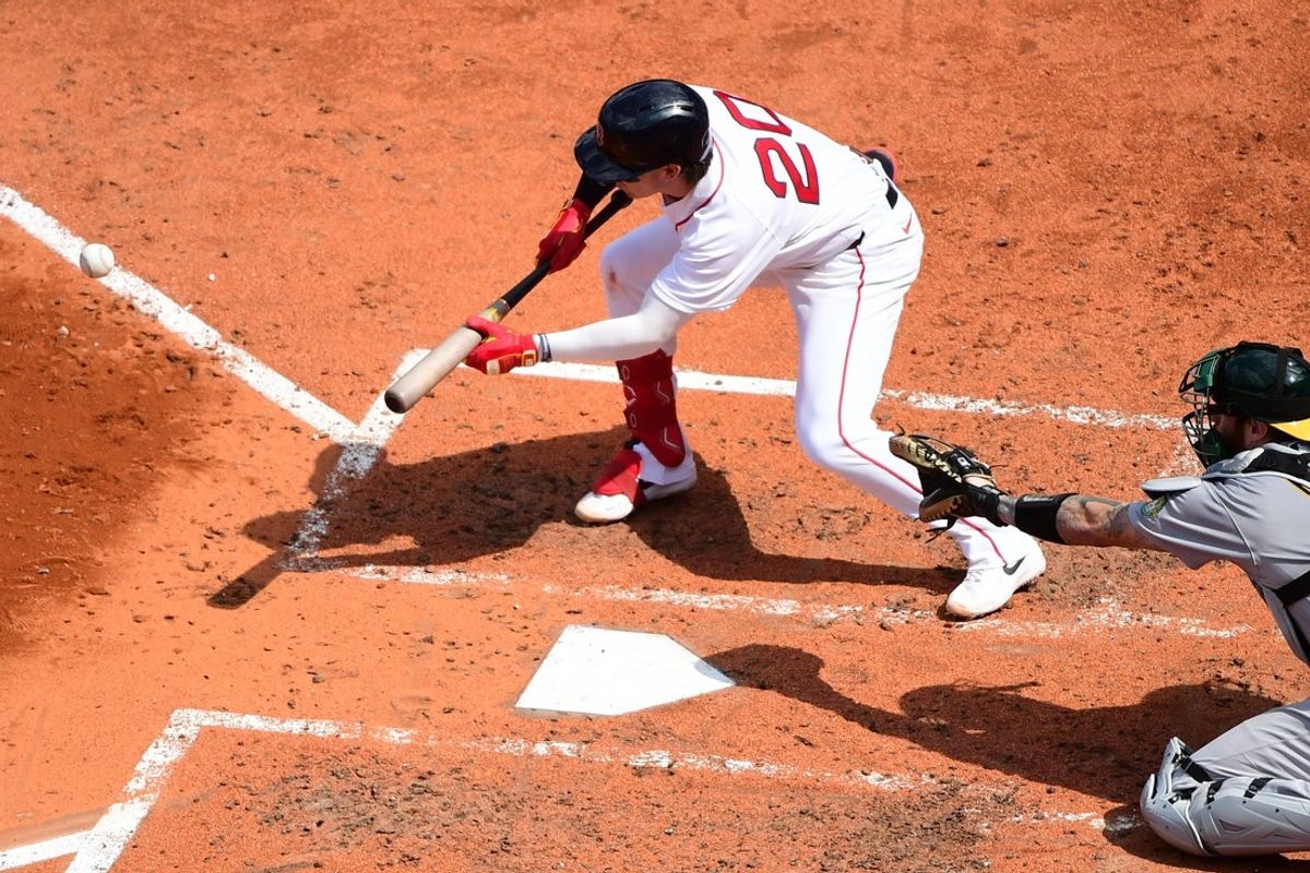 Aug 9, 2026; Boston, Massachusetts, USA;  Boston Red Sox third baseman Nick Sogard (20) lays down a sacrifice bunt during the fifth inning scoring right fielder Eli White (38) against the Athletics at Fenway Park. Mandatory Credit: Bob DeChiara-Imagn Images