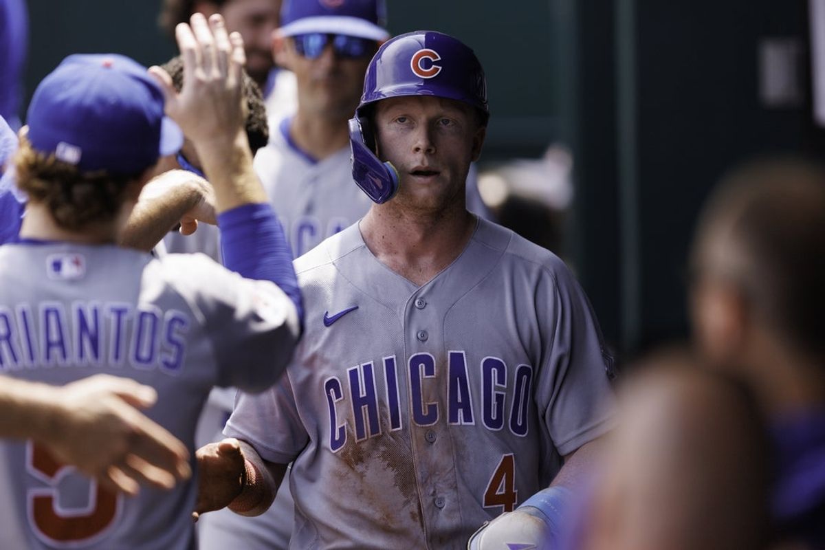 Aug 9, 2026; Kansas City, Missouri, USA; Chicago Cubs center fielder Pete Crow-Armstrong (4) celebrates in the dugout after scoring during the fourth inning against the Kansas City Royals at Kauffman Stadium. Mandatory Credit: William Purnell-Imagn Images