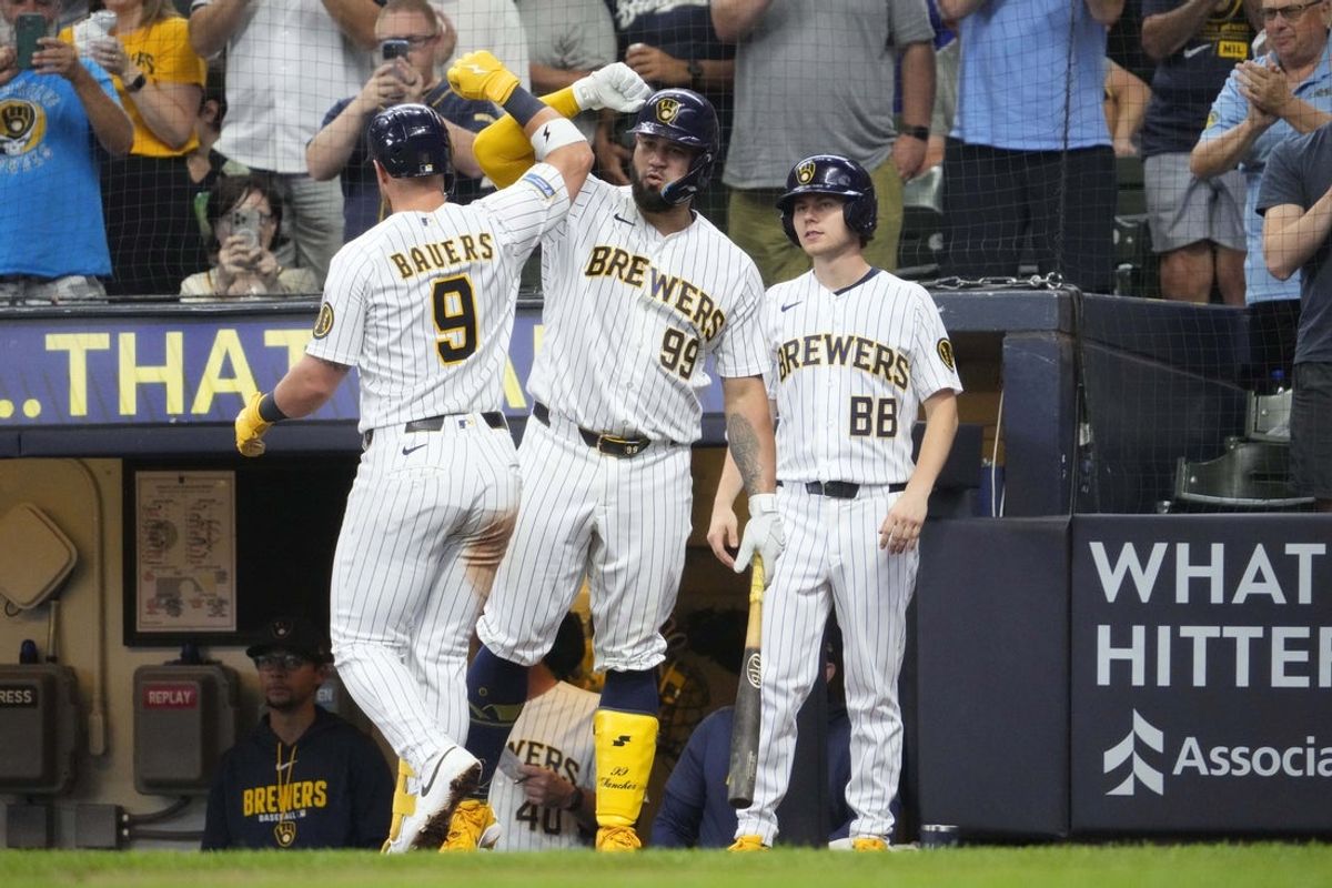 Aug 9, 2026; Milwaukee, Wisconsin, USA; Milwaukee Brewers first baseman Jake Bauers (9) is congratulated by catcher Gary Sanchez (99) after hitting a home run against the Minnesota Twins in the fifth inning at American Family Field. Mandatory Credit: Michael McLoone-Imagn Images