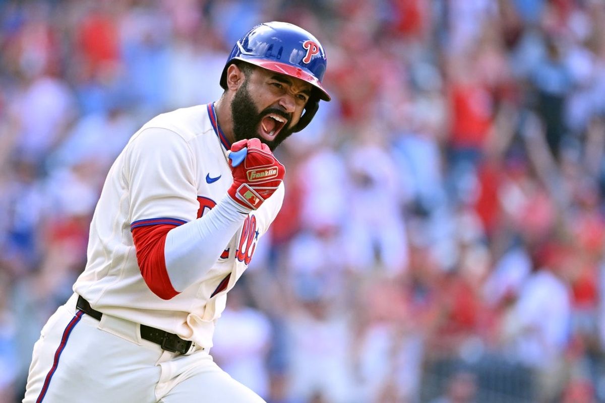 Aug 9, 2026; Philadelphia, Pennsylvania, USA;  Philadelphia Phillies center fielder Derek Hill (49) celebrates his walk-off RBI single during the twelfth inning against the Toronto Blue Jays at Citizens Bank Park. Mandatory Credit: Eric Hartline-Imagn Images