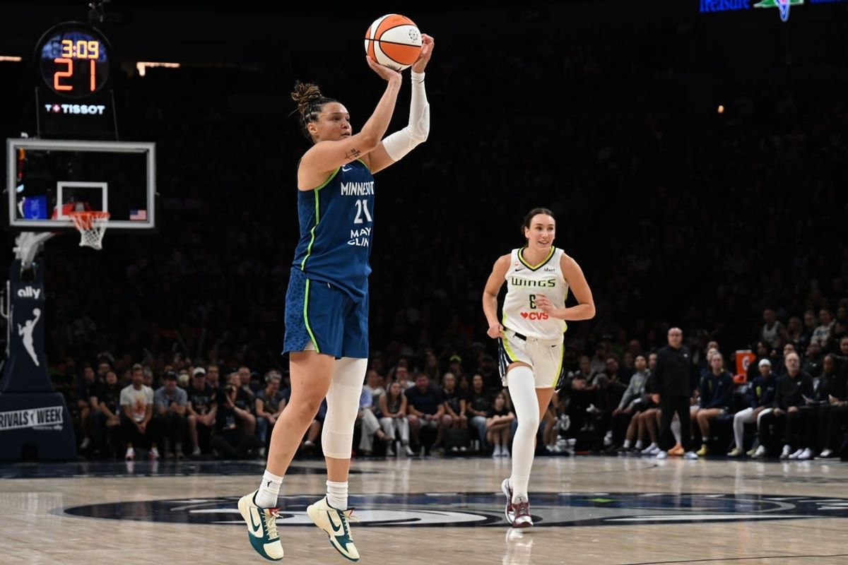 Aug 9, 2026; Minneapolis, Minnesota, USA; Minnesota Lynx guard Kayla McBride (21) shoots a three point basket as Dallas Wings forward Alanna Smith (8) looks on during the third quarter at Target Center. Mandatory Credit: Jeffrey Becker-Imagn Images