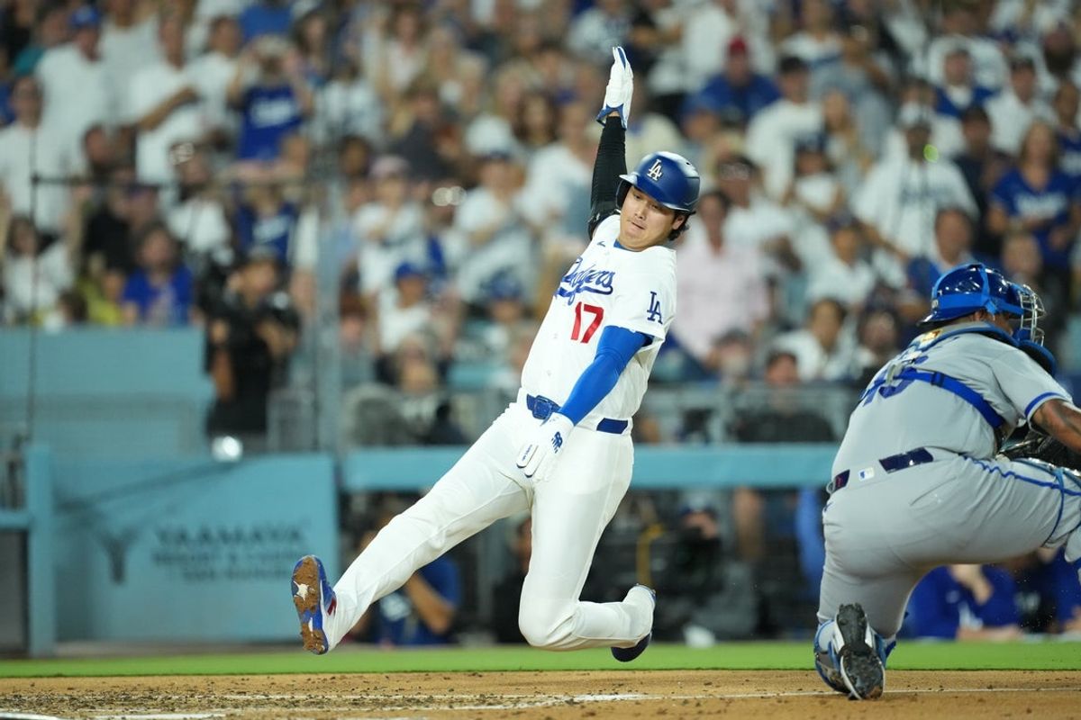 Aug 10, 2026; Los Angeles, California, USA; Los Angeles Dodgers two-way player Shohei Ohtani (17) slides into home plate to score a run during the third inning against the Kansas City Royals at Dodger Stadium. Mandatory Credit: Kirby Lee-Imagn Images