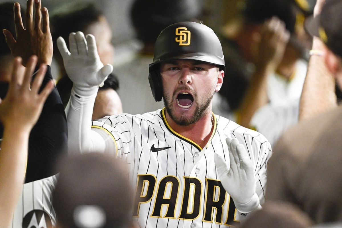 Aug 10, 2026; San Diego, California, USA; San Diego Padres center fielder Jackson Merrill (3) is congratulated after hitting a two-run home run during the seventh inning against the Milwaukee Brewers at Petco Park. Mandatory Credit: Denis Poroy-Imagn Images