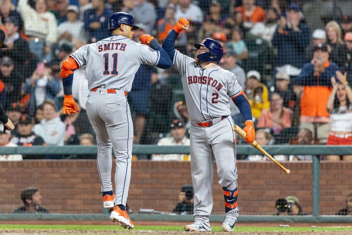 Aug 10, 2026; San Francisco, California, USA; Houston Astros infielder Cam Smith (11) celebrates his solo home run during the seventh inning with Houston Astros catcher Christian Vazquez (2) against the San Francisco Giants at Oracle Park. Mandatory Credit: Bob Kupbens-Imagn Images