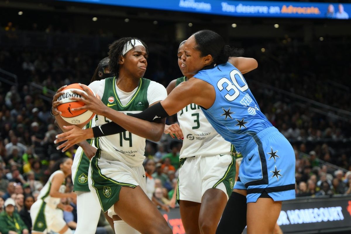 Aug 10, 2026; Seattle, Washington, USA; Seattle Storm center Dominique Malonga (14) protects the ball from Chicago Sky forward Azura Stevens (30) during the second half at Climate Pledge Arena. Mandatory Credit: Steven Bisig-Imagn Images