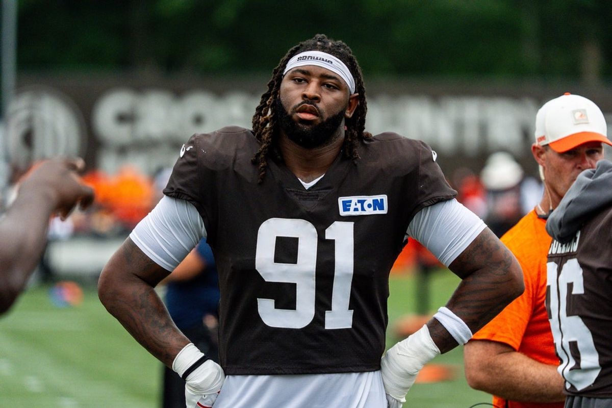 Cleveland Browns defensive end Alex Wright (91) takes in drill instruction during day 12 of training camp, Aug. 11, 2026, in Berea, Ohio.