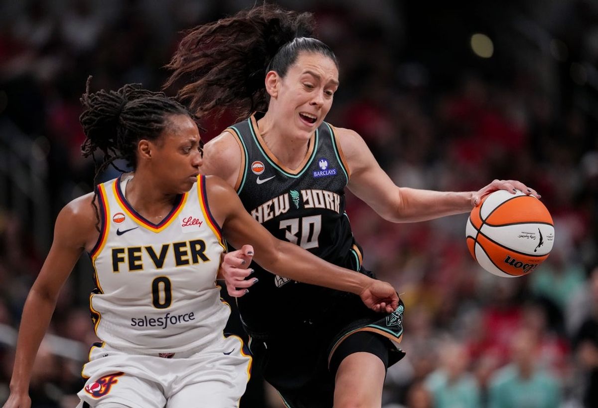 Indiana Fever guard Kelsey Mitchell (0) guards New York Liberty forward Breanna Stewart (30) on Tuesday, Aug. 11, 2026, during the game at Gainbridge Fieldhouse in Indianapolis.
