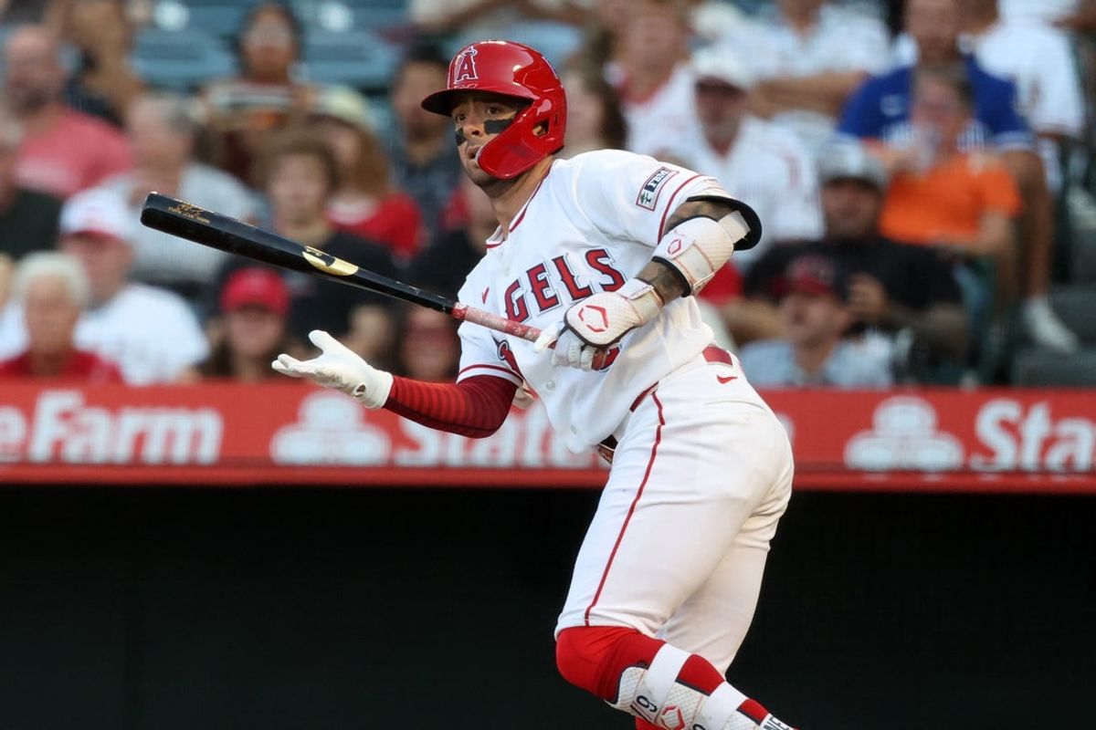 Aug 11, 2026; Anaheim, California, USA;  Los Angeles Angels shortstop Zach Neto (9) hits a double during the first inning against the Texas Rangers at Angel Stadium. Mandatory Credit: Kiyoshi Mio-Imagn Images