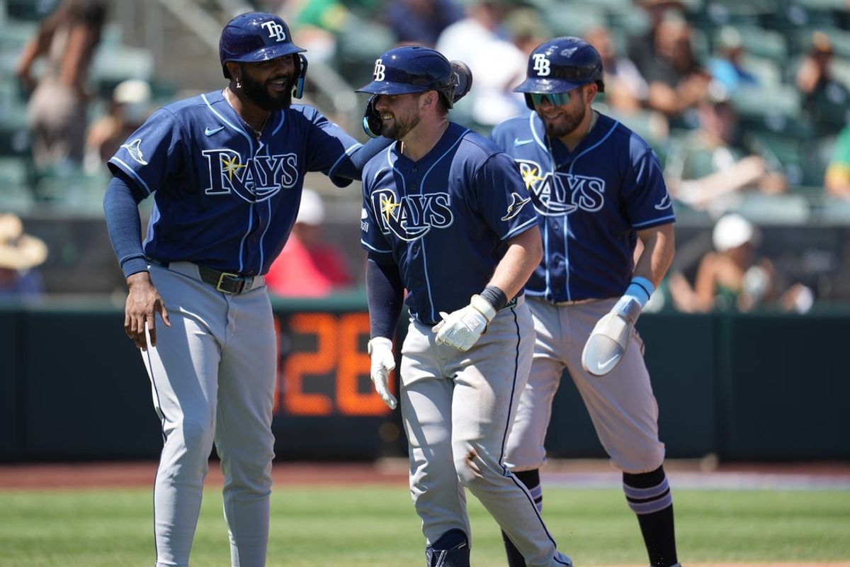 Aug 12, 2026; West Sacramento, California, USA; Tampa Bay Rays catcher Liam Hicks (34) is congratulated by third baseman Junior Caminero (13) after hitting a three-run home run against the Athletics in the fourth inning at Sutter Health Park. Mandatory Credit: Cary Edmondson-Imagn Images