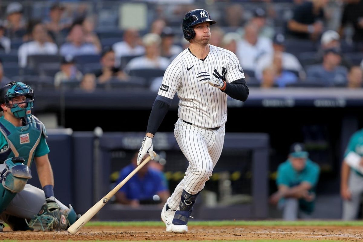 Aug 12, 2026; Bronx, New York, USA; New York Yankees third baseman Ryan McMahon (19) follows through on an RBI double against the Seattle Mariners during the second inning at Yankee Stadium. Mandatory Credit: Brad Penner-Imagn Images