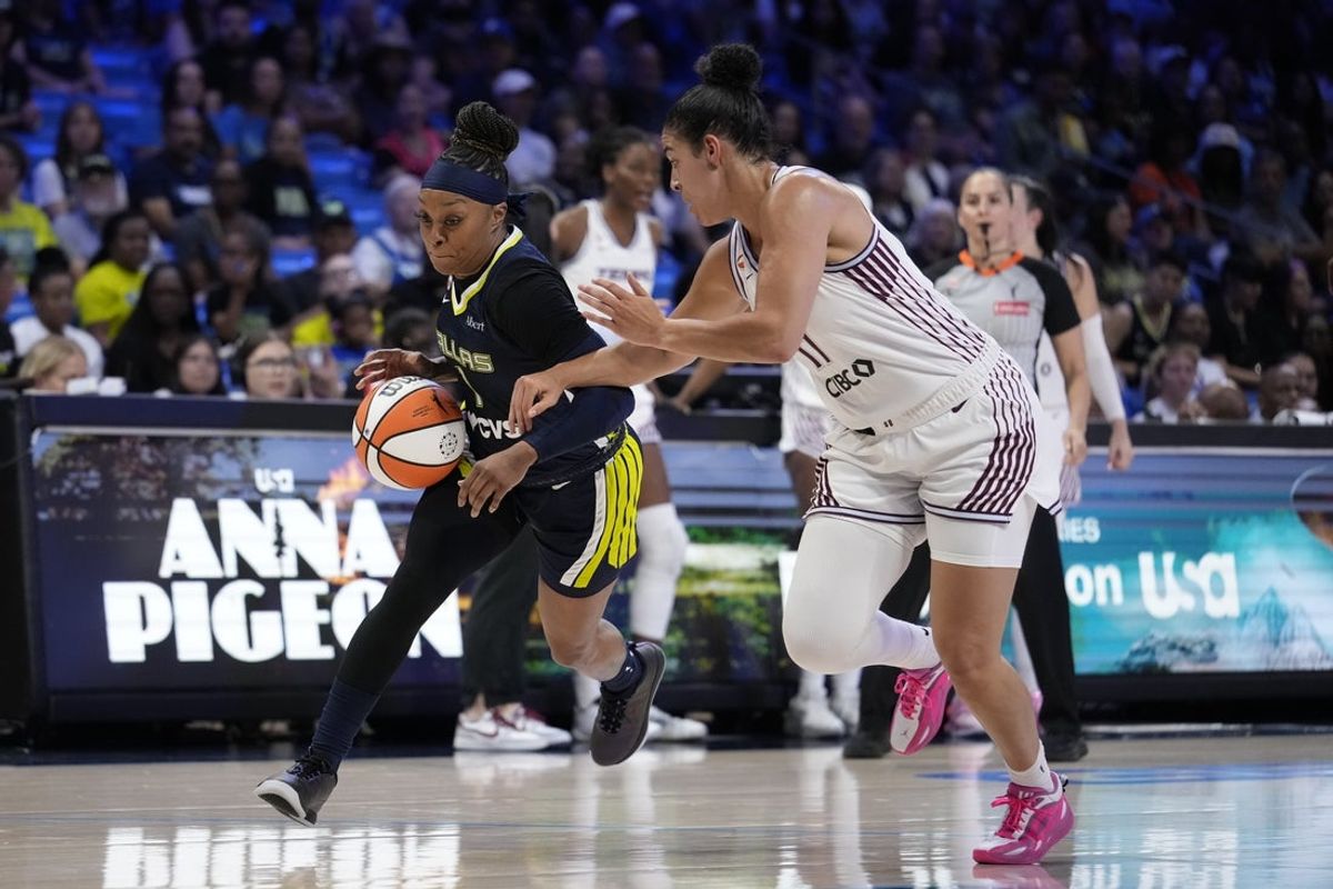 Aug 12, 2026; Arlington, Texas, USA;  Dallas Wings guard Odyssey Sims (1) works past Toronto Tempo guard Kia Nurse (11) during the second quarter at College Park Center. Mandatory Credit: Raymond Carlin III-Imagn Images